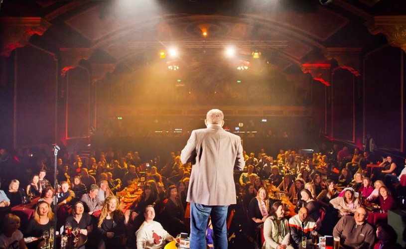 Stand-up in front of crowd at Komedia' Krater comedy night